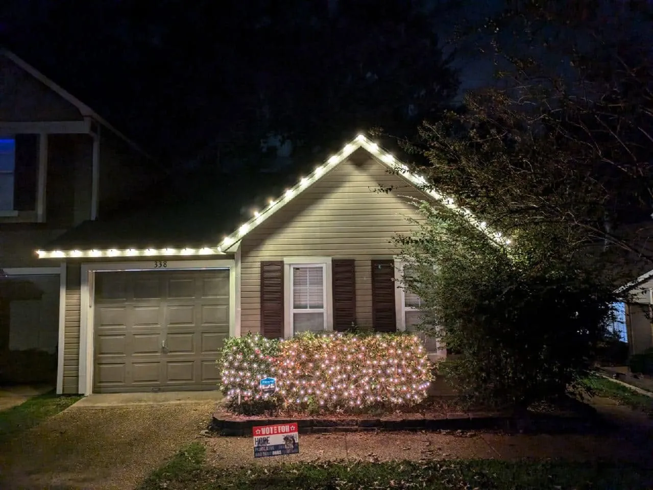 Single story home with a warm white light line along the eaves